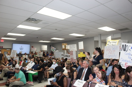 A number of protestors were in attendance during the Williamson County Schools Board of Education meeting Aug. 10. (Wendy Sturges/Community Impact Newspaper)