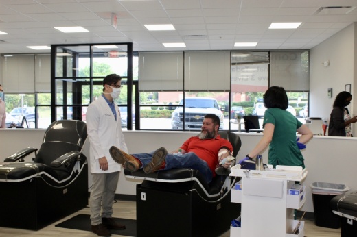 Blood Assurance Medical Director Dr. Ted Kieffer (left) stands with Williamson County resident Jon Smotherton as he makes the first donation at the nonprofits new center in Cool Springs. (Wendy Sturges/Community Impact Newspaper)