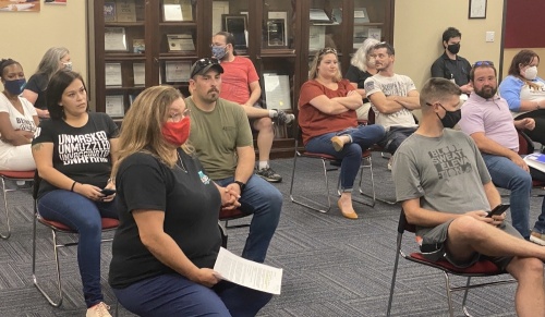 The meeting room at the Pflugerville ISD Administration Building was at capacity during an Aug. 16 special meeting. (Brian Rash/Community Impact Newspaper)