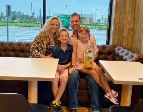 Local McDonald's owner Laurie Glaser-Swift sits with her son, Brandon Swift; husband, Brian Swift; and daughter, Sloane Swift at her now open location. (Courtesy Laurie Glaser-Swift)
