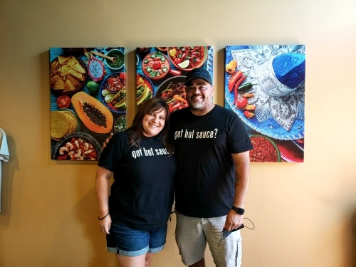 Michael (right) and his wife, Tanya Valencia, opened their hot sauce business in 2012. (Ali Linan/Community Impact Newspaper)