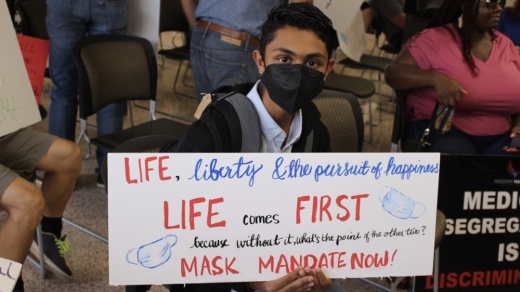 Maysum Syed, a senior at Travis High School, spoke before the board in favor of a mask mandate during the Aug. 23 meeting. (Claire Shoop/Community Impact Newspaper)