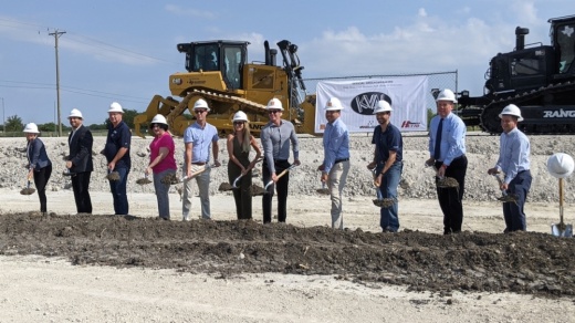 Kval representatives and city officials break ground on the new Kval facility. (Carson Ganong/Community Impact)