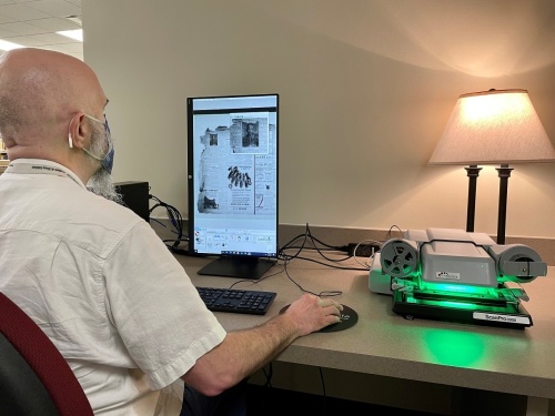 Daniel Sample, manager of FBCL’s Genealogy and Local History Department, demonstrates the ScanPro 3000 microfilm scanner in the Genealogy and Local History Department at George Memorial Library in Richmond. (Courtesy Fort Bend County Libraries)