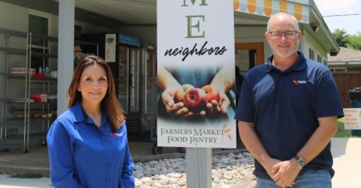 woman and man in front of building