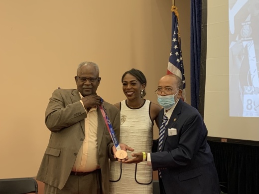 Olympic bronze medalist Raevyn Rogers with Wings Track Club head coaches William Wilmington and B.T. Williams. (Rynd Morgan/Community Impact Newspaper).