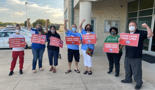 Members of the Pflugerville Educators Association gathered outside the PfISD administration building prior to a Sept. 16 meeting. (Brian Rash/Community Impact Newspaper)