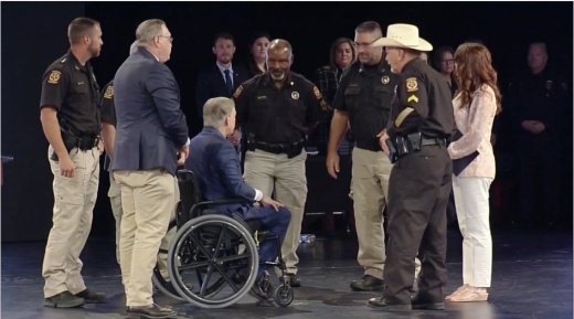 Cpl. Lonnie Bruce Harrison, (right) Gov. Greg Abbott and members of the Montgomery County Constable Precinct 5 Office gather at the Star of Texas Awards where Harrison was a recipient. (Courtesy of Montgomery County Precinct 2 Commissioner Charlie Riley's office)