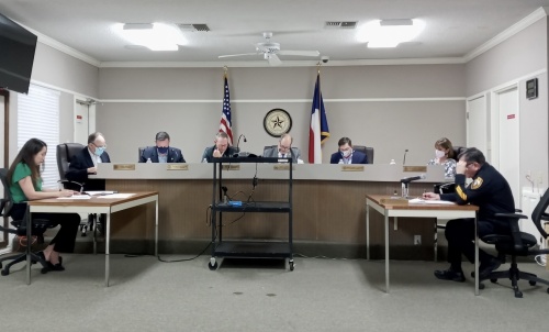 Hill Country Village Mayor Gabriel Durand-Hollis (center right) leads the city council's discussion on the property tax rate for fiscal year 2022 on Sept. 16. (Edmond Ortiz/Community Impact Newspaper)