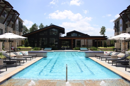 Among the amenities at Creekside Park The Grove is a central resort-style swimming pool with a cabana, wet bar and fireplace near the clubhouse. (Andrew Christman/Community Impact Newspaper)