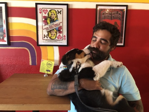 The Far Out Lounge owner Pedro Corvhalo spends many days at the restaurant
with his puppy Billie. (Photos by Maggie Quinlan/Community Impact Newspaper)
