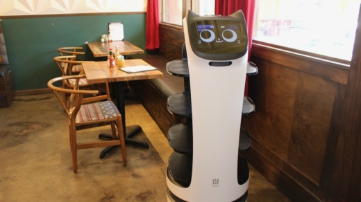 The robot server at Layered in McKinney is programmed to carry food on its tiered built-in trays to diners. (Miranda Jaimes/Community Impact Newspaper)