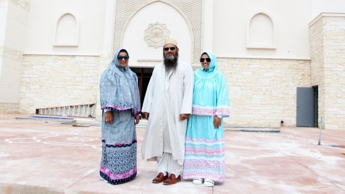 Rashida Rasheed, left, stands in front of the new Masjid with her husband, Shaikh Aliasger Rasheed, and their daughter Sarrah Rasheed. (Karen Chaney/Community Impact Newspaper)