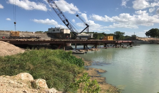 A trestle and crane system built by Zachry Construction is used to work on the Lake Dunlap dam. Three bear-trap style crest gates will be replaced with new hydraulically-actuated steel crest gates. (Courtesy Guadalupe-Blanco River Authority, Zachry Construction Corp.)
