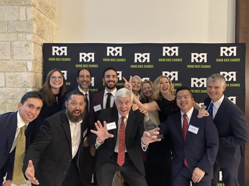 
Don Quick (center) is seen with his team in 2019 after winning a lifetime achievement award from the Round Rock Chamber.  (Photos courtesy Don Quick & Associates)