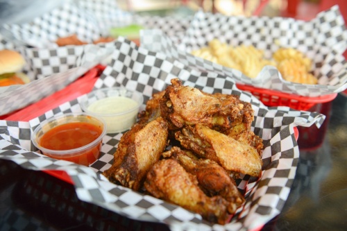 Naked wings start at $7.95 for six and are served with a variety of sauces, such as ghost pepper pineapple. (Ethan Pham/Community Impact Newspaper)