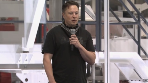 Screen shot of Elon Musk speaking with a microphone