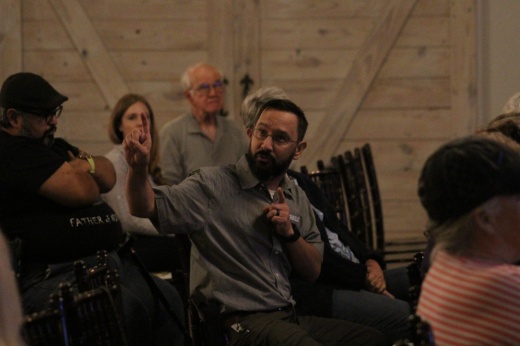 Spring resident Matt Brogan speaks at the Old Town Spring Improvement District's town hall meeting Oct. 5. (Emily Lincke/Community Impact Newspaper)