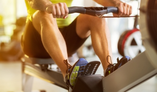 Man using rowing machine