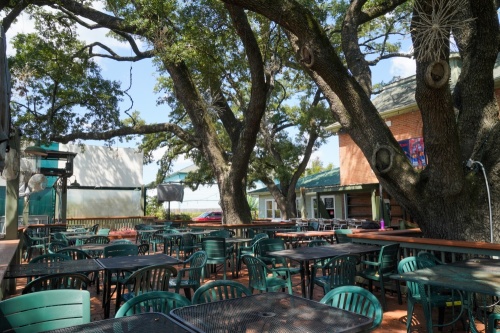 Live Oak Grill will reopen Oct. 15 with a new food and drink menu. The eatery is known for its shaded patio beneath five 130-year-old live oak trees. (Courtesy Dylan McEwan)