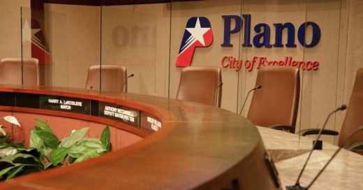 empty chairs in council chambers