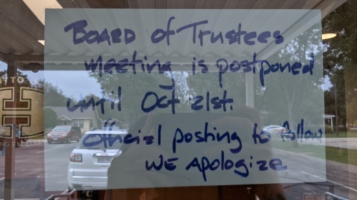 A sign posted outside the Hutto ISD administration building alerted would-be meeting goers to the postponement. (Carson Ganong/Community Impact Newspaper)