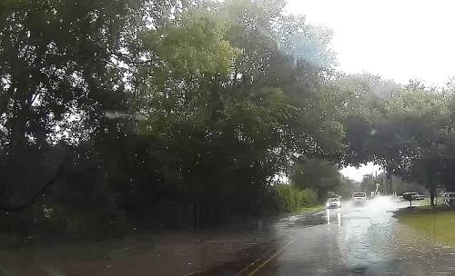 A dash cam still shows flooding on Brandt Road after rain. (Courtesy Jon Iken)