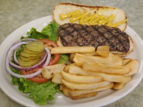 The Homestyle Hamburger ($7.99) made with lean ground beef and served with lettuce, tomato, pickles and onion. 
