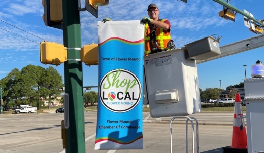 shop local banner being set up.