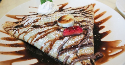 The Parisian Nutella ($7.95) is one of nine sweet crepes on the menu and is filled with Nutella’s famous hazelnut cocoa spread, strawberries and bananas. (Hannah Zedaker/Community Impact Newspaper)