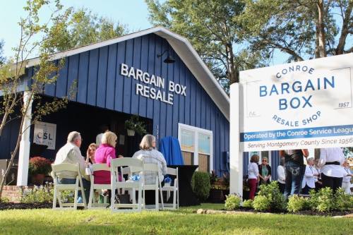 Community members and public officials gathered at the Bargain Box Resale Shop on Oct. 14 to commemorate the unveiling of a historical marker honoring the Conroe Service League. (Anna Lotz/Community Impact Newspaper)