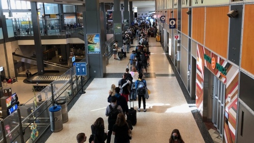 Passengers wait in a security checkpoint line at the Austin-Bergstrom International Airport. The three existing checkpoints would receive machine upgrades but would remain largely unchanged. (Benton Graham/Community Impact Newspaper)