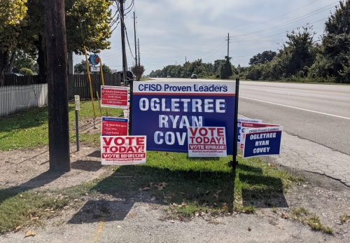 Cy-Fair ISD school board campaign signs are posted outside Juergen's Hall Community Center during Harris County's early voting period in October. (Danica Lloyd/Community Impact Newspaper)