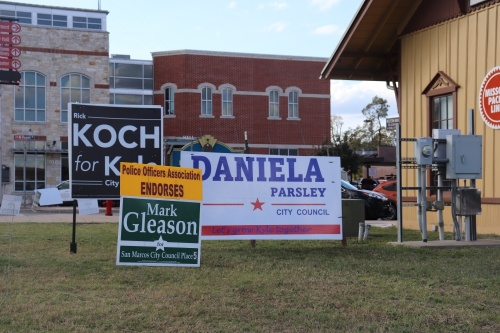 Campaign signs near downtown Kyle for candidates for various positions throughout Hays County are seen on Election Day, Nov. 2. (Zara Flores/Community Impact Newspaper)

