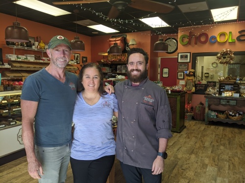 Scott and Carrie Koussouji opened Copper Kettle Chocolate Factory in 2014. Their son Ryan (right) is the head chocolate maker. (Jishnu Nair/Community Impact Newspaper)