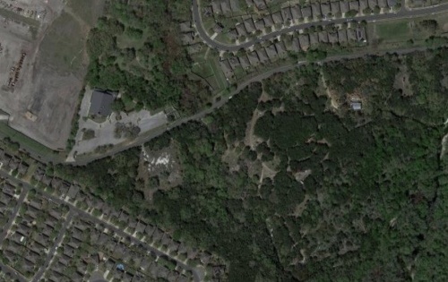 The triangle of wooded area south of Brandt Road and east of I-35 is set to become an affordable housing complex. (Courtesy of Google Maps)