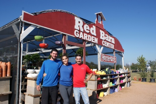 Purchasing manager Tristian Barry, left, stands with his siblings, Angelica Berkes and Gaige Barry, at the Red Barn Garden Center in Leander. (Eddie Harbour/Community Impact Newspaper)