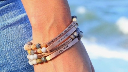 wrist with three bracelets