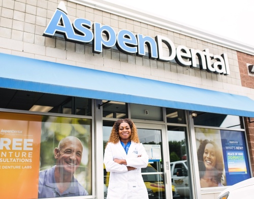 Aspen Dental will be opening a new location in New Caney's Valley Ranch Town Center in the first half of 2022. Dr. Jasmin Henville poses outside a location in Massachusetts. (Courtesy Aspen Dental)