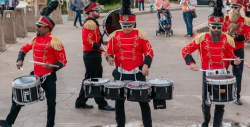 drummers dressed up as toy soldiers in red jackets