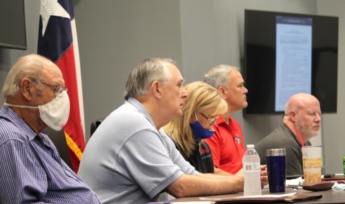 From left, Harris County Emergency Services District 11 Commissioners Fred Grundmeyer, Steve Williams, Karen Plummer, Kevin Brost and Robert Pinard voted 4-0 to approve the district running its own election for next's year's May 7 election. Plummer abstained from the vote. (Community Impact Newspaper staff)