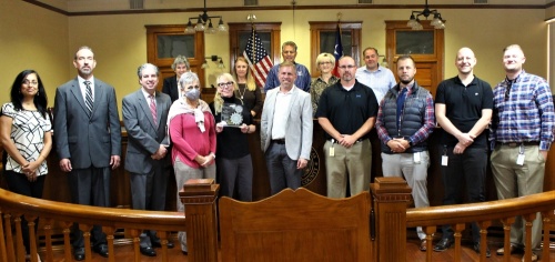 The team that helped digitize Williamson County's evidence portal stands with the county's commissioners and Judge Bill Gravell Nov. 16 during commissioners court where it was recognized for a pair of national awards for the project. (Courtesy Williamson County)