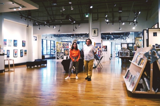 Maggie Lyon and Joshua Green help local artists at ArtUs Co in Northwest Austin. (Iain Oldman/Community Impact Newspaper)