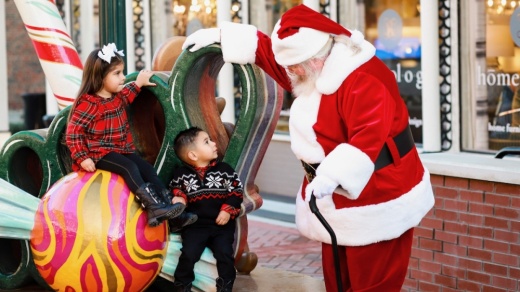 two children with Santa