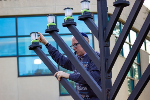 Rabbi Barry Gelman, with the Evelyn Rubenstein Jewish Community Center, talks to kids about Hanukkah on Nov. 30 during one of the center's community menorah lightings. (Courtesy Evelyn Rubenstein Jewish Community Center)