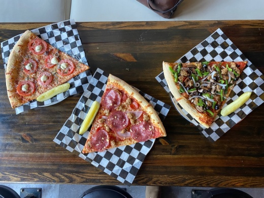 Slapbox Pizzicheria serves a variety of different slices and pies on dough made daily. (Photos by Brooke Sjoberg)