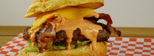 On the menu at Hippo Burgers are beef hamburgers and chicken sandwiches adorned in a variety of toppings like jalapenos, barbecue sauce, mushrooms, guacamole and Sriracha. (Courtesy Hippo Burgers)