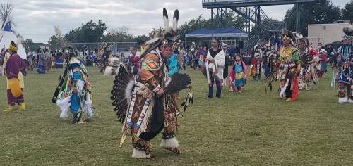 The Pow Wow begins with the Grand Entry in which all dancers enter the arena led by head dancers before the competition begins. (Jarrett Whitener/ Community Impact Newspaper)