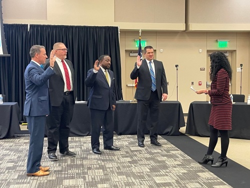 From left, Klein ISD board of trustee incumbents Ronnie K. Anderson, Chris "CT" Todd and Doug James, as well as newly-elected trustee Dustin Creager were sworn into office Dec. 13. (Hannah Zedaker/Community Impact Newspaper)