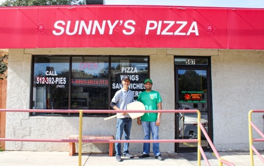 Sunny's Pizza & Wings owner Mohammed Jaffer (left) stands next to Karim Iqbal, the general manager, in front of the pizzeria. (Photos Eric Weilbacher/Community Impact Newspaper)